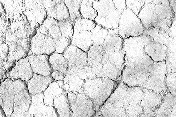 Texture soil dry crack background pattern of drought lack of water of nature white black old broken.