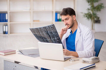Young male doctor radiologist working in the clinic