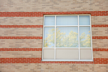 Brick building complex signifies strength, stability, professionalism, heritage, and a thriving...