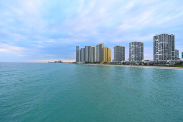 Fototapeta na wymiar View of Sunny Isles Beach from the pier during cloudy winter eveninf (Florida, USA)