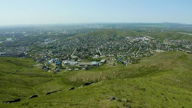 Aerial View o flag mountains and the observation deck of Ust Kamenogorsk , summer sunny day view from the throne of the mountains and the city.
