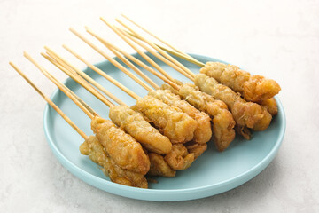 Sempol Ayam, made from minced chicken, spices and eggs. Served with chili sauce. Indonesian traditional food
