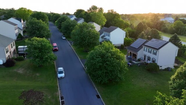 Suburban neighborhood at sunset. Aerial view of family homes.