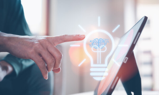 ideas Innovative the future of Technology, start up concept, Businessmen touching virtual light bulb, intelligent analytics, artificial intelligence, and energy saving presentations.