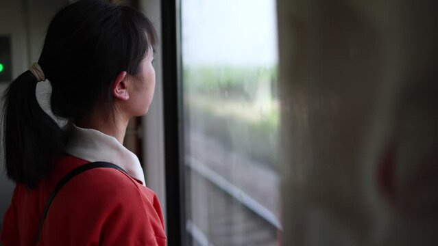 Looking out of the window while traveling by train