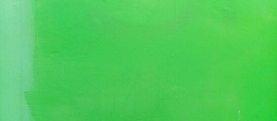 The texture of the green cement wall against a green background, taken at close range