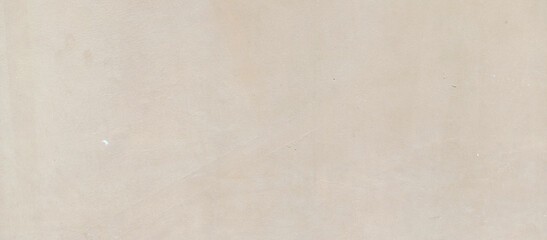 The texture of the gray cement wall on a gray background, taken at close range