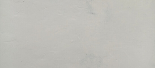 The texture of the gray cement wall on a gray background, taken at close range