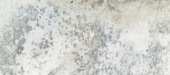 The texture of the gray cement wall on a gray background, taken at close range
