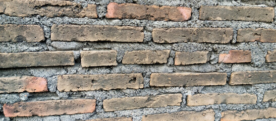 The texture of the brick wall is brick background, taken at close range