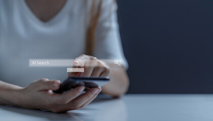 Next generation of technology in search, research and cyber assistance using artificial intelligence (AI). Female hand uses AI search engine via mobile phone.