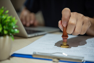 Contract law or paper work business and finance document rubber stamp. For official and legal contracts and agreements, financial statements, investment contracts, real estate documents.