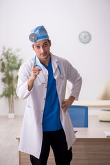 Young male doctor otologist working in the clinic