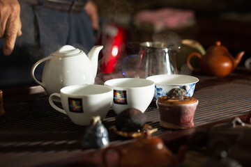 pouring tea into a teacup	