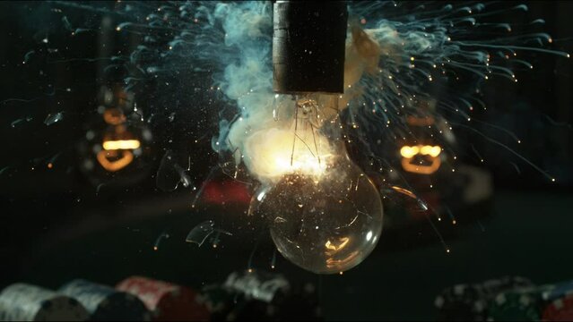 A lightbulb explodes in stunningly sharp, slow motion, which reveals bits of glass and filament.