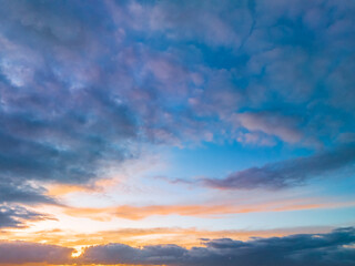 Naklejka na ściany i meble Aerial sunrise seascape with calm seas and a mix of high and low cloud