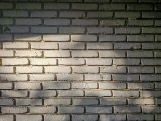 Light and shadow on brick wall.