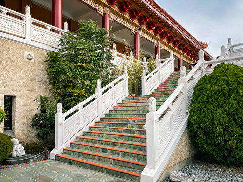 Wollongong, NSW, Australia-June 24, 2022: Architectural details at Nan Tien Buddhist Temple Complex with colorful roofs, exquisite decorations, intricate stairways, stone sculptures and serene gardens