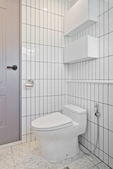 Naklejka na ściany i meble A bathroom designed with long vertical tiles