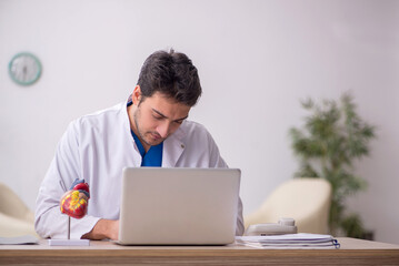 Young male doctor in telemedicine concept