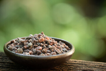 Black himalayan salt on nature background.