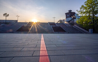 The square is flooded with the sun in the early morning.