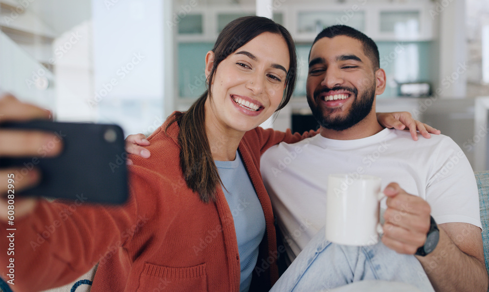 Sticker Home, selfie and couple smile on sofa for social media post, online vlog and internet with coffee. Dating, morning and happy man and woman take picture for update, bonding and relax in living room