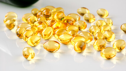 Close-up of many omega-3 oil capsules.