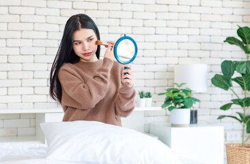 Millennial Asian beautiful cheerful happy female model in casual long sleeve sweater shirt outfit...