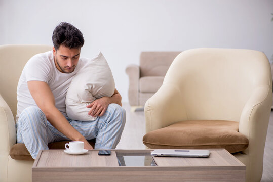 Young man starting day at home