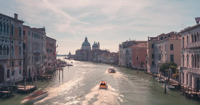 Gran Canal in Venice zoom in timelapse Venezia during early morning with boats and gondola from accademia bridge