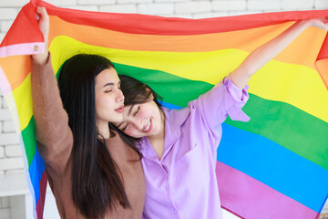 Millennial two Asian beautiful pretty female lesbian girlfriends lover in casual outfits sitting...