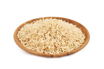 raw brown rice in wood plate isolated on white background. pile of raw brown rice isolated. heap of raw brown rice isolated                                                