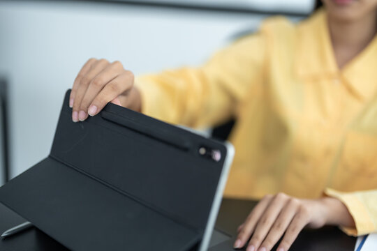 Business women image of hands close and open a laptop computer on table after finished using it