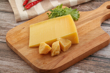 Parmesan hard cheese with small pieces