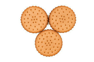 Three round biscuits on a white background. View from above. Sweet crunchy cookies with filling.