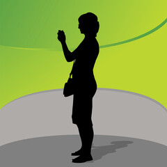 An image of a female texting or taking a picture.