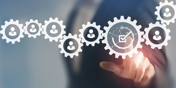 HR compliance, employee regulation and compliance, business ethics, employee performance evaluation concept. Businessman pointing at check mark with employee icons on smart background and copy space.