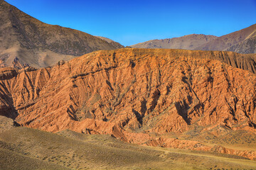 Beautiful view of cliffs from yellow red limestone. Kyrgyzstan.