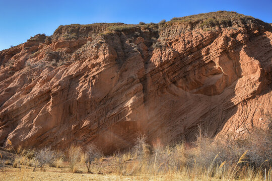 Beautiful view of cliffs from yellow red limestone. Kyrgyzstan.