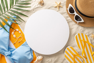 Seaside vacation inspiration. Overhead shot of beach must-haves: sunglasses, cap, sandals,...