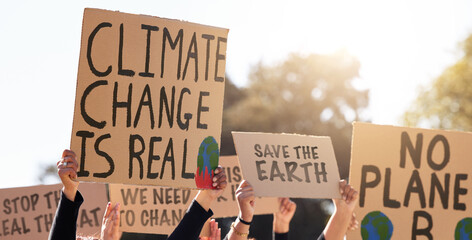 Protest, climate change and poster with a group of people outdoor at a rally or march for...