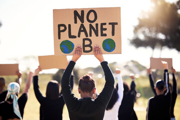 Protest, climate change and sign with a group of people outdoor at a rally or march for...