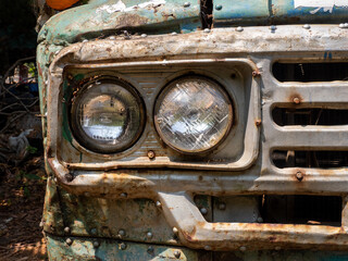 Fototapeta na wymiar Old, abandoned blue truck