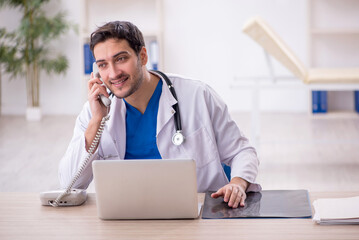 Young male doctor working in the clinic