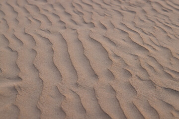 Waves of sand on the seashore. Selective focus. Close up. Background