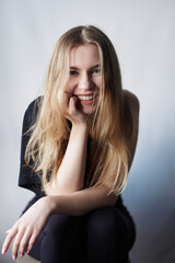 Fototapeta premium Portrait of a young woman with natural makeup and natural styling.Advertising natural cosmetics.Advertising for a beauty salon.Care cosmetics, face and body skin care. High quality photo