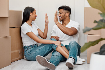 Box, celebration and couple high five in new home excited for property, apartment and real estate...