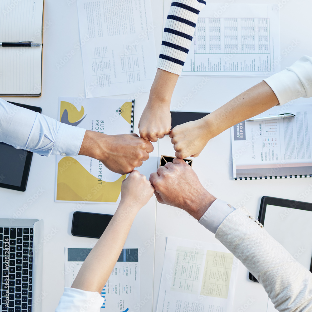 Canvas Prints Top view, hands circle and fist bump in office for motivation, team building and collaboration with proposal. Business people, solidarity and together for teamwork, group vision and paperwork on desk