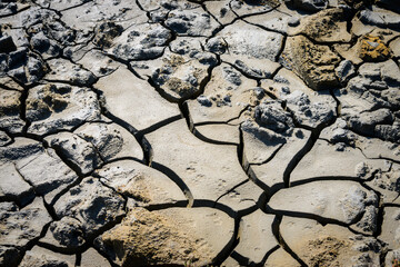 Dry cracks in the earth on a cloudy day in Camargue